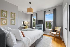 a bedroom with a large bed and a tv at King Bed, Near DT and Best Restaurants, Pets OK! in Tacoma