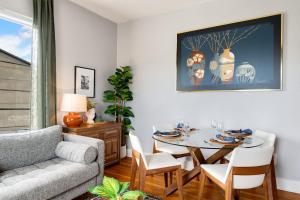 a living room with a table and a couch at King Bed, Near DT and Best Restaurants, Pets OK! in Tacoma