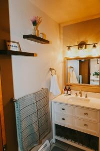 a bathroom with a sink and a mirror at Breck Ski Chalet, Pet Friendly, Private Hot Tub and Scenic Views in Breckenridge +53 photos