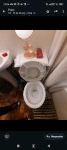 Un baño con un inodoro blanco en una habitación. en Casa castro chiloe, en Castro 14 fotos más