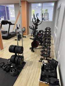 a gym with a row of exercise bikes at Apartamento em Bertioga, ótima localização, Bertioga Residence Club in Bertioga