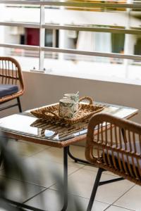 a table with a coffee cup on top of it at L Escapade - Studio tropical chic et parking prive in Saint-Denis