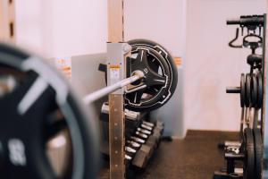 a gym with several rows of exercise equipment at Stylish Minimalist Loft 7 & Gym in Namba Compact Studio 5 in Wada