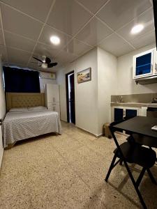 Ένα ή περισσότερα κρεβάτια σε δωμάτιο στο Dominico Colonial