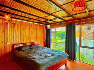 a bedroom with a bed and a large window at Sky View hostel in Sapa +73 photos