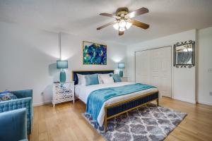 a bedroom with a bed and a ceiling fan at King Bed with Pool Table in Chicopee