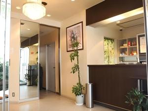 a lobby with potted plants on the wall at Hotel Akai in Tokyo