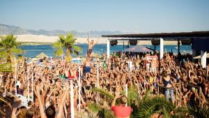 a large crowd of people at a concert at Apartments Verica in Pag