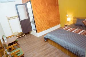 Ένα ή περισσότερα κρεβάτια σε δωμάτιο στο Anlani homestay