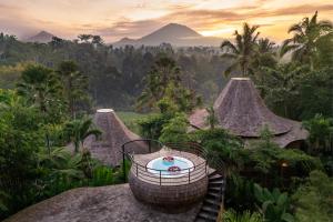 a hot tub on the roof of a resort at Ecosix Bali in Tampaksiring