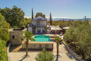 an aerial view of a house with a swimming pool at Villa 5 elements in Gostinjac