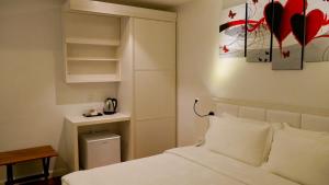 Postel nebo postele na pokoji v ubytování Pine Garden Hotel + 29 fotografií