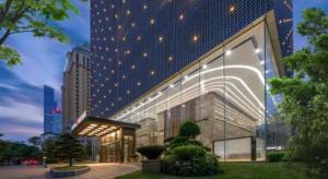 a large building with lights on the side of it at Echeng Hotel Nanning the Mixc Convention in Nanning