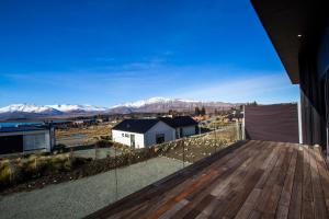 a view of the mountains from the balcony of a house at Nordic Escape - Lake Tekapo in Lake Tekapo