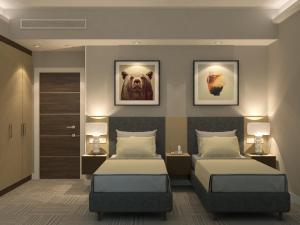 a hotel room with two beds and two lamps at GREEN Which Hotel Kokshetau in Kokshetau +59 photos