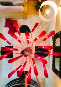 a red fan with red lights in a room at Andromache's Cozy Villa close to Meteora-Trikala in Tríkala +94 photos