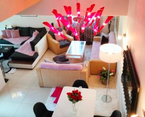 a living room with a couch and a table at Andromache's Cozy Villa close to Meteora-Trikala in Tríkala