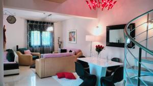 a living room with a couch and a table at Andromache's Cozy Villa close to Meteora-Trikala in Tríkala