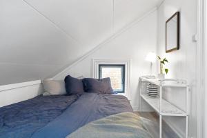 Ένα ή περισσότερα κρεβάτια σε δωμάτιο στο Porsgrunn city center - modern apartment with garage