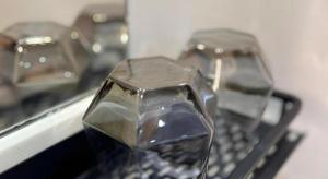 two pieces of metal sitting on top of a keyboard at Goodrich Hotel in Hong Kong