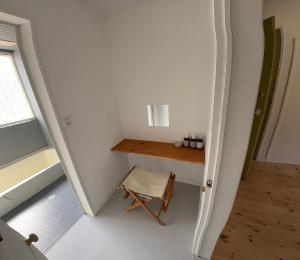 a small room with a table and a chair at papan room in Miyota