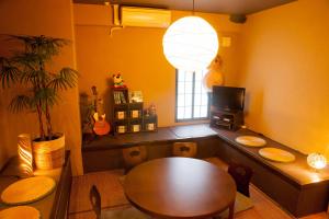 a dining room with a table and a window at K's House Tokyo Oasis - Asakusa Downtown in Tokyo