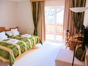 Postel nebo postele na pokoji v ubytování Hotel Berghof