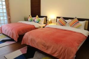 Voodi või voodid majutusasutuse Yilan Amy B&B toas
