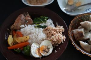a plate of food with rice and meat and vegetables at Sri Vishwa Buddha MUni in Kalagedihena