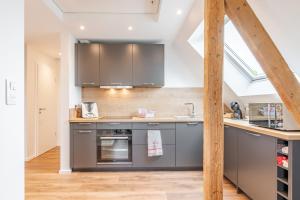 Kuchyň nebo kuchyňský kout v ubytování Alsace Moderne - T2 60 m2, terrasse, fibre & Netflix - Niederbronn-les-Bains