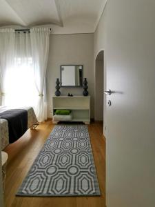 a room with a door and a rug on the floor at Small Castle With Sea View In Campiglia Marittima in Campiglia Marittima