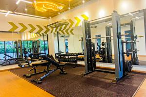 a gym with several treadmills and machines at Balcony Breeze at Ara Residence Nilai by HCK in Nilai
