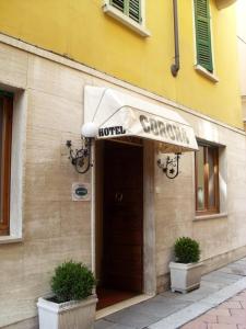 a hotel sign on the front of a building at Albergo Corona in Salsomaggiore Terme