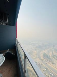 an overlook of a balcony with a view of a city at Moonrisehomestays in Ghaziabad +4 photos