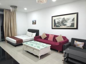 a room with a bed and a couch and a table at Tarragon Family Suite Apartment in Kuala Lumpur +109 photos