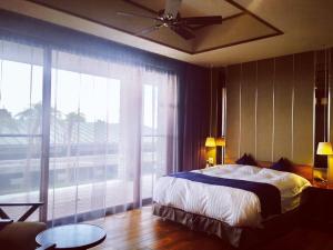 Postel nebo postele na pokoji v ubytování The House of Ocean