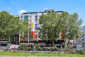 a building with trees in front of it at Ramada by Wyndham Istanbul Old City in Istanbul