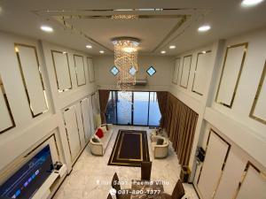 an overhead view of a hall with a chandelier at Peema Villa ภีมะ วิลล่า in U Thong