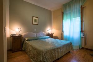 Postel nebo postele na pokoji v ubytování Hotel Relais Valle Orientina