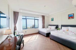 Postel nebo postele na pokoji v ubytování Malibu Resort