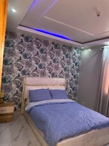 Postel nebo postele na pokoji v ubytování Casa Família Ndombe