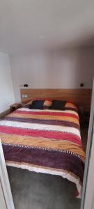 Ένα ή περισσότερα κρεβάτια σε δωμάτιο στο Mobil home chez Thierry et Véro +1 φωτογραφίες