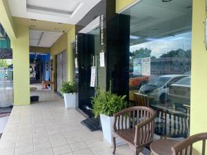 a store front with a bench and a window at Five Ferns Hotel in Bandar Baru Bangi +36 photos