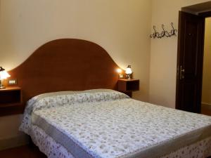 Postel nebo postele na pokoji v ubytování Hotel 4 Coronati