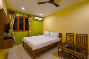 Postel nebo postele na pokoji v ubytování White yellow residency