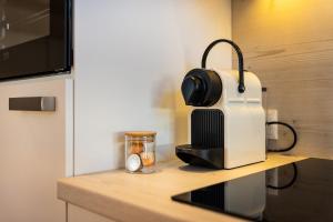 a coffee maker on a counter in a kitchen at S Apartment in Flachau