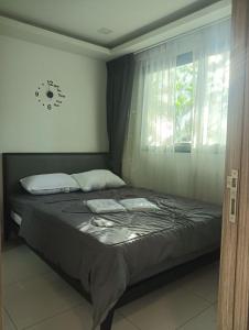 Ένα ή περισσότερα κρεβάτια σε δωμάτιο στο Arcadia Beach Continental By Palmera Pattaya +29 φωτογραφίες