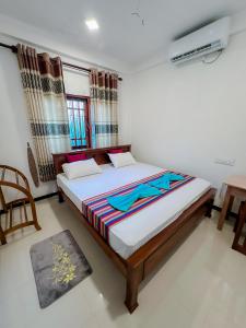 Ένα ή περισσότερα κρεβάτια σε δωμάτιο στο Nature Villa Hiriketiya