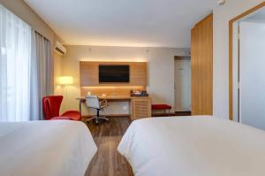 Giường trong phòng chung tại Radisson Blu São Paulo +136 ảnh