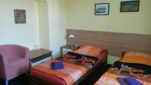 Postel nebo postele na pokoji v ubytování Guest House U Zámku